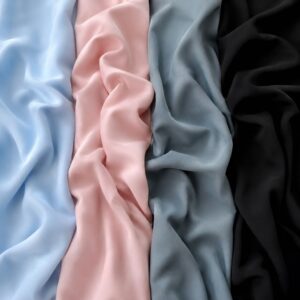 Verschillende kleuren outlet stof voor tafelkleden, decoratie en bruiloftstyling met lichtblauw, zachtroze, blauwgrijs en zwart.